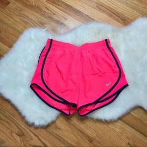 Neon coral Nike shorts